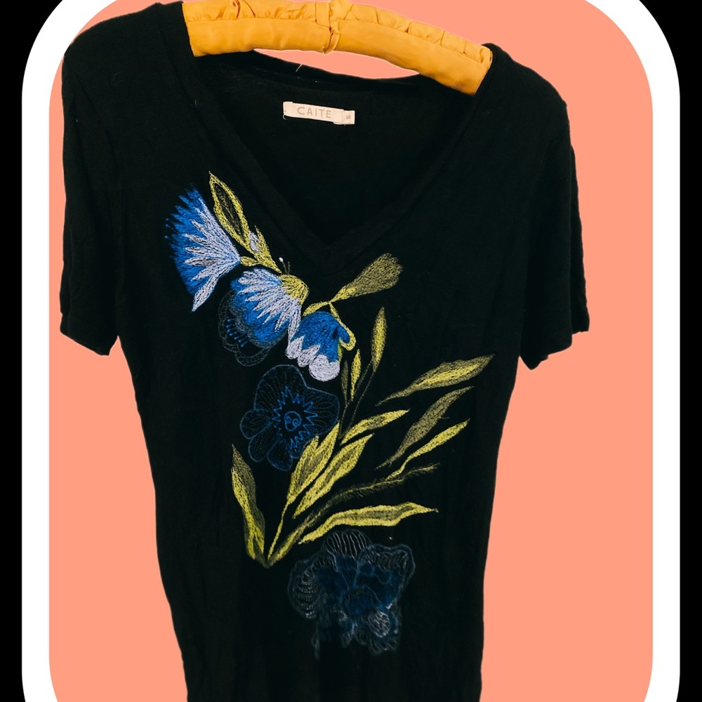 Embroidered black floral T-shirt.